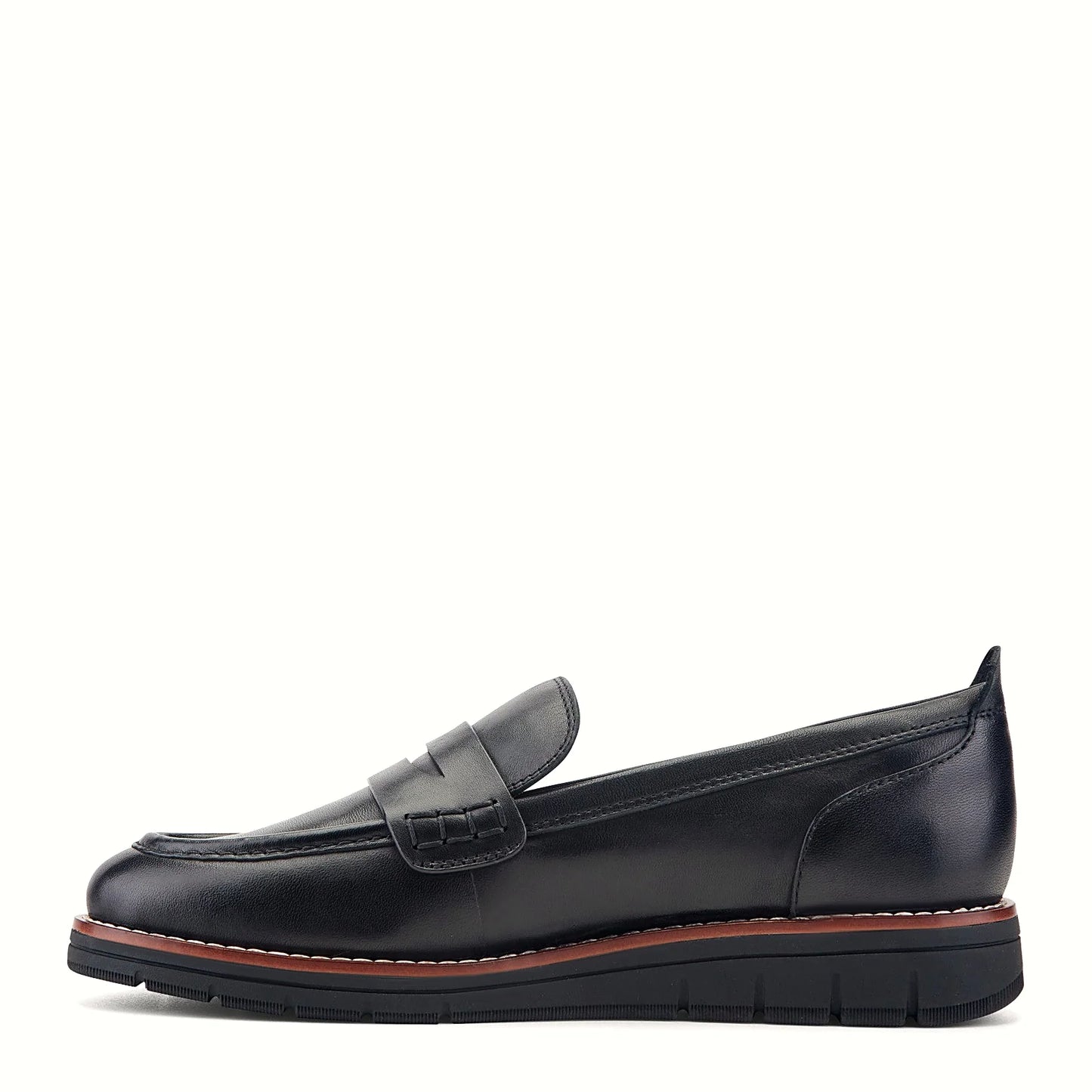 Pair of penny strap loafers photographed from above on a plain background