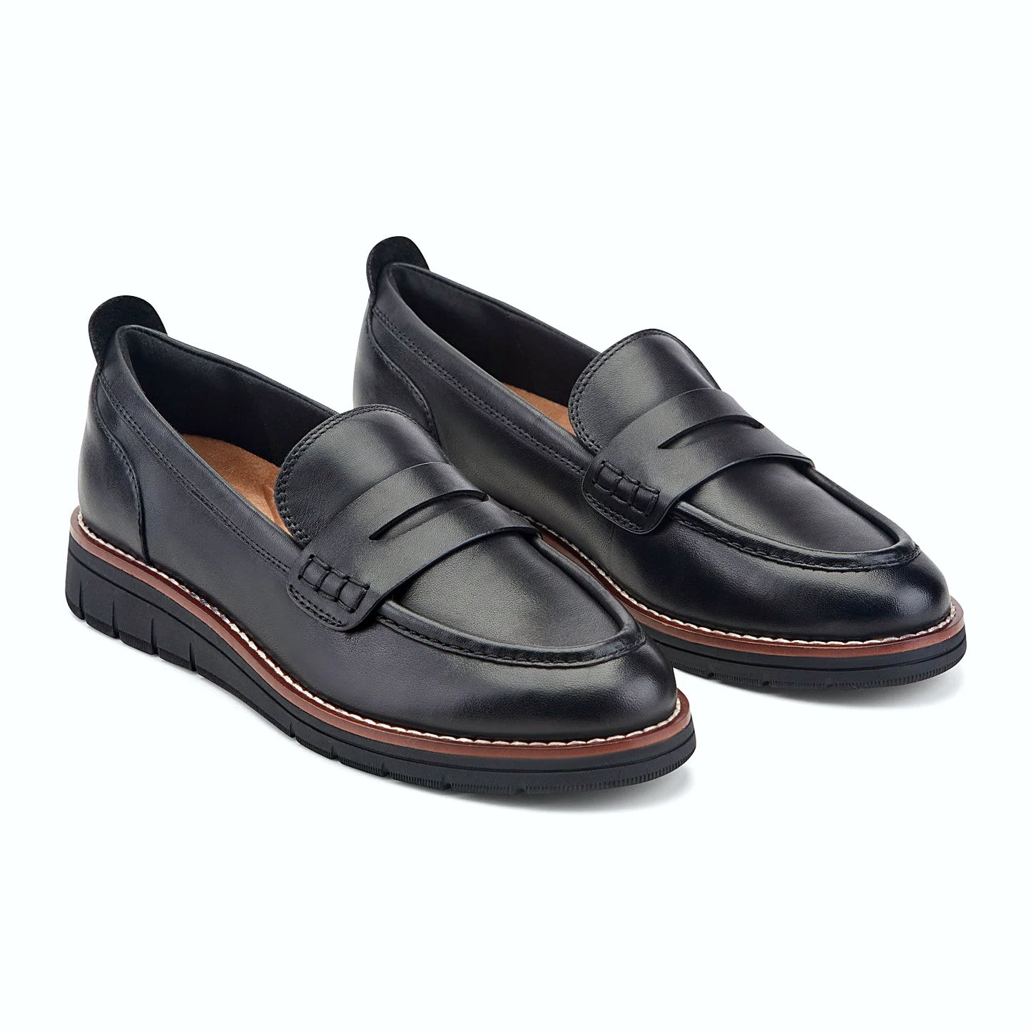 Close view of the contrast welt and clean apron stitching on a loafer