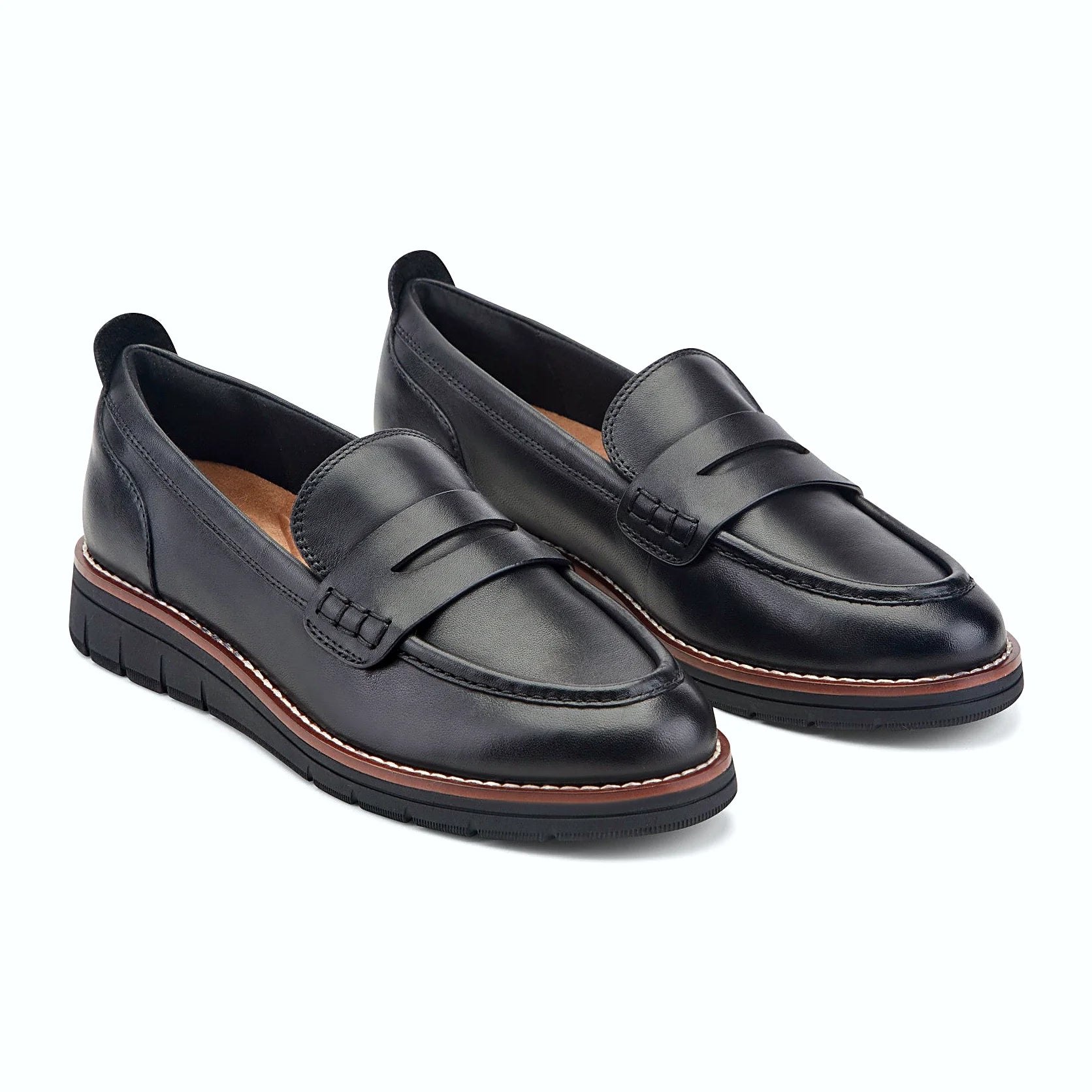 Close view of the contrast welt and clean apron stitching on a loafer