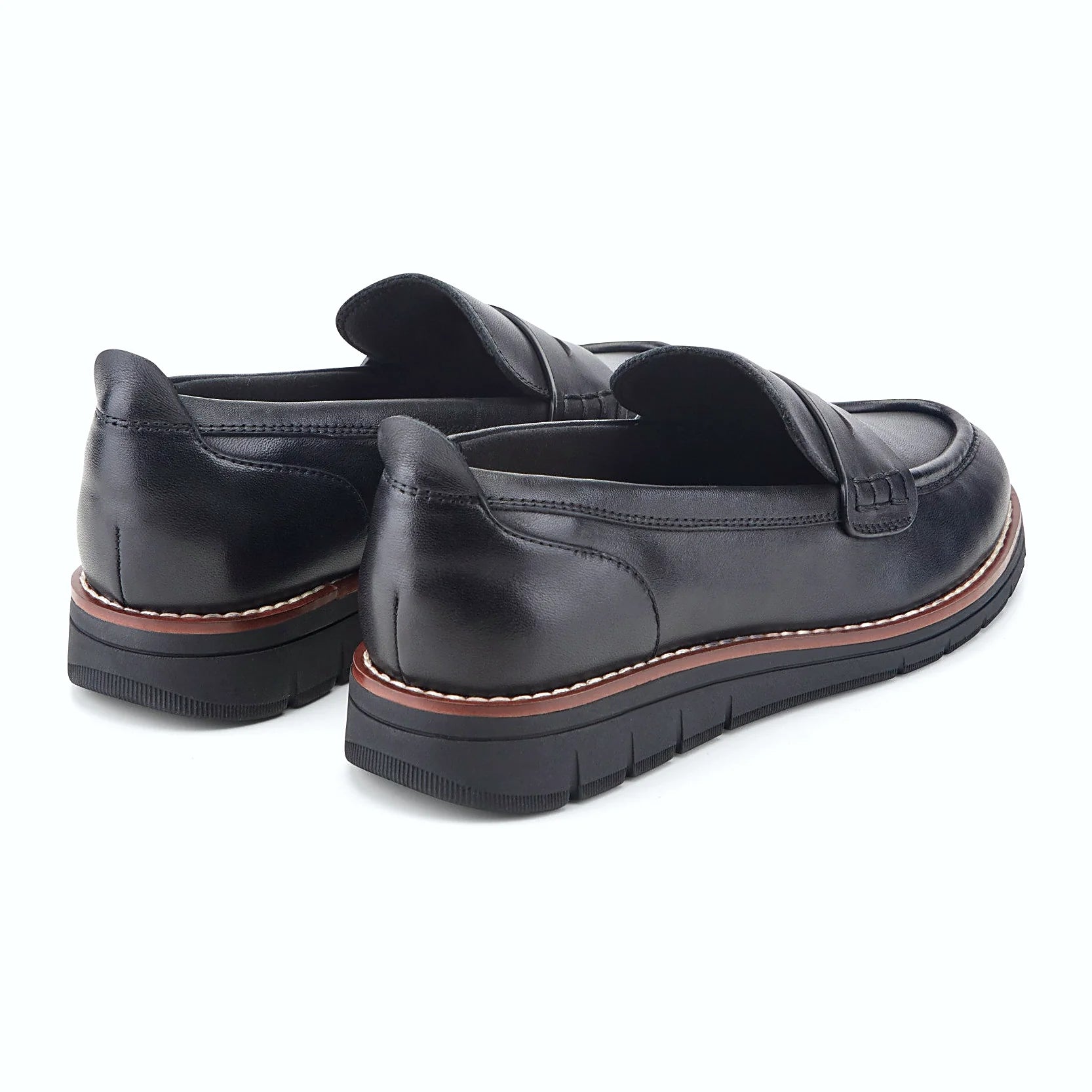 Rear view of a penny loafer showing the subtle wedge profile