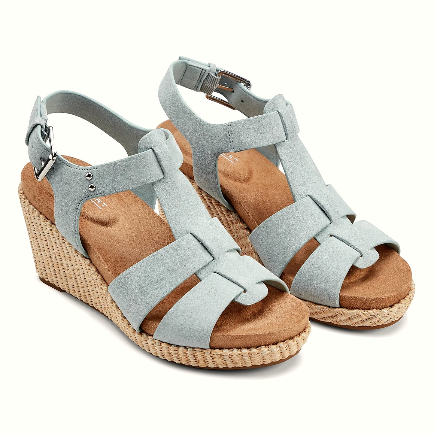 Close view of the metal stud accents and looped bands on a wedge sandal