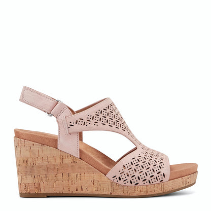 Side view of a light pink wedge sandal with a perforated T-strap upper