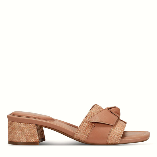 Side view of a medium natural slide sandal with a wide single strap