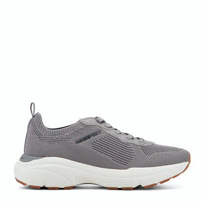 Side view of a medium gray knit sneaker with tonal overlays along the laces