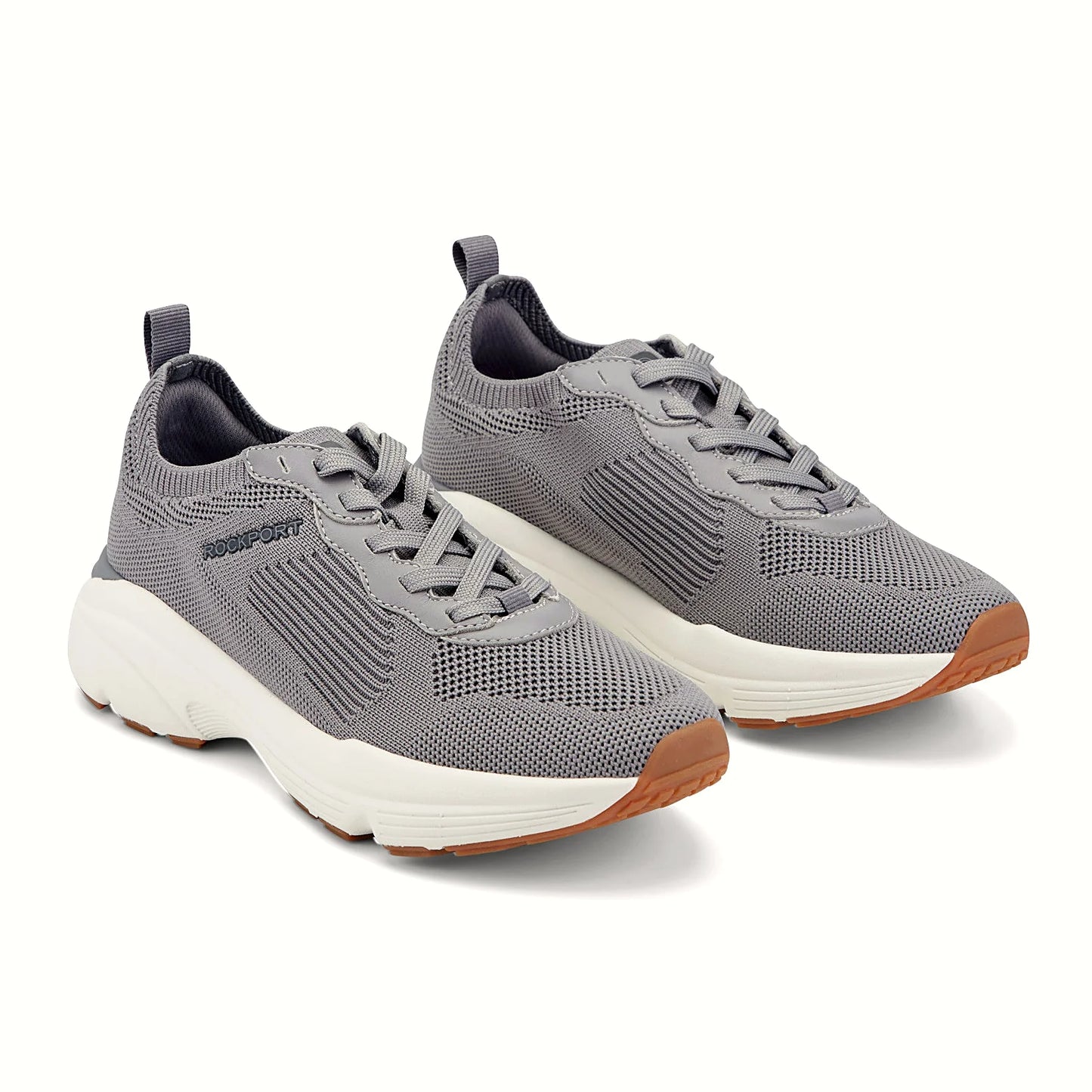 Close view of the ribbed midfoot panel and lace system on a knit sneaker