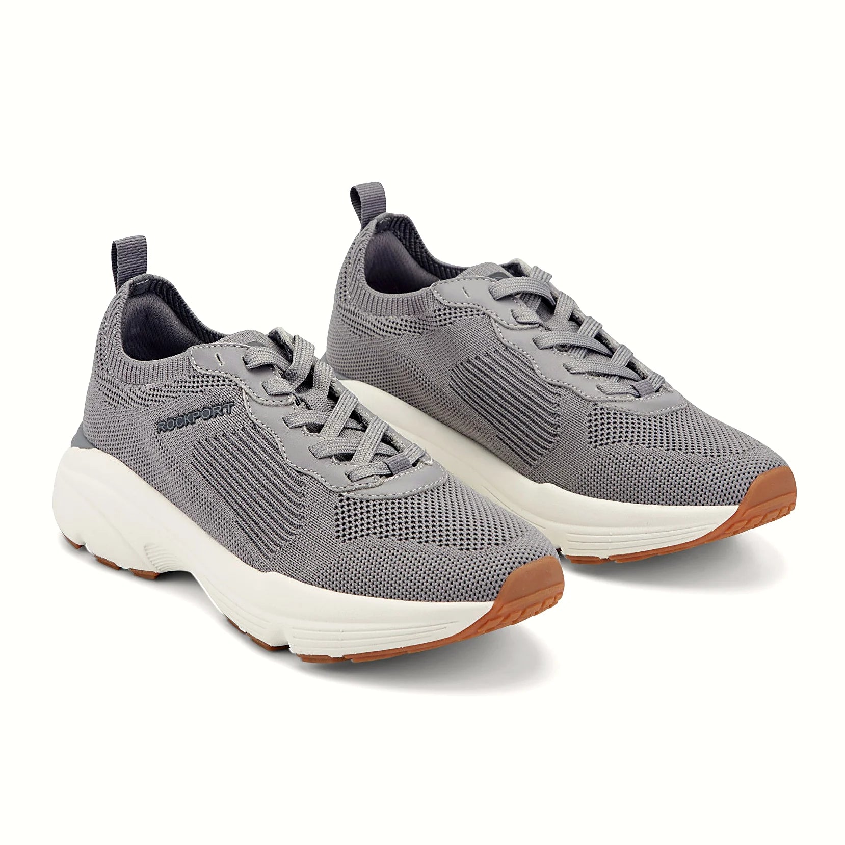 Close view of the ribbed midfoot panel and lace system on a knit sneaker