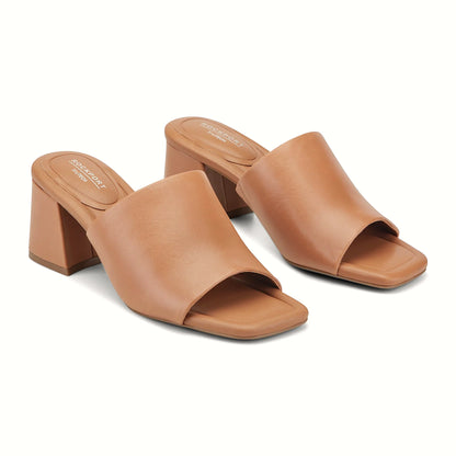 Close view of the draped leather band and square toe on a slide sandal