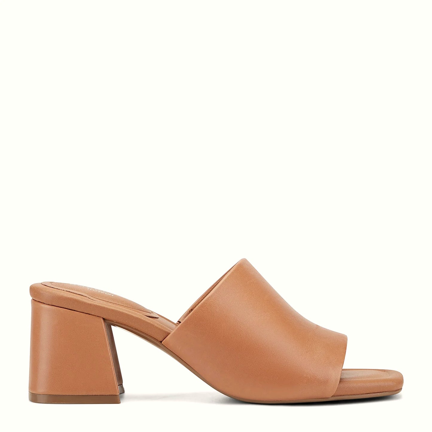 Side view of a brown leather slide sandal with a wide band across the foot