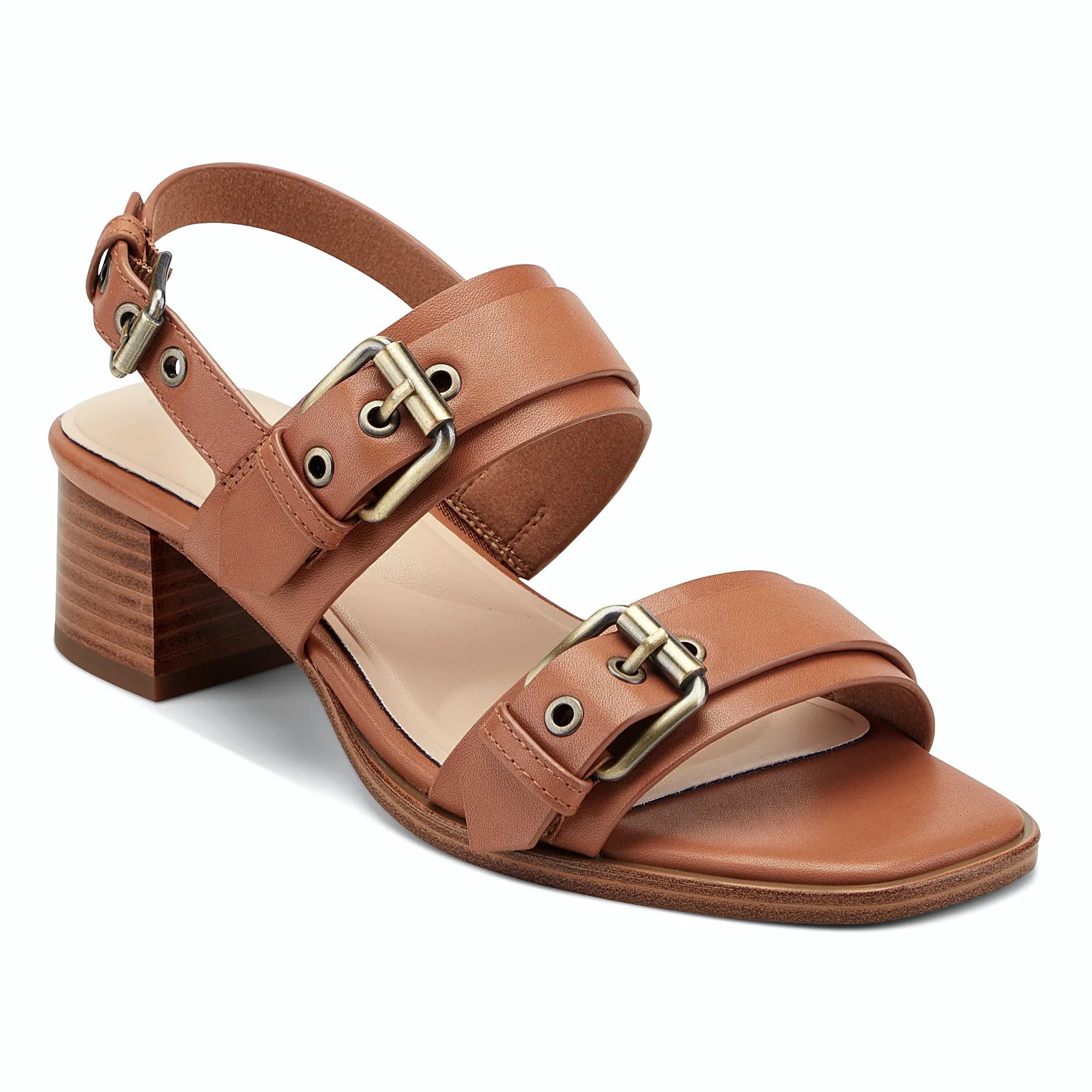 Close view of the oversized antiqued buckles and grommet accents on a sandal strap