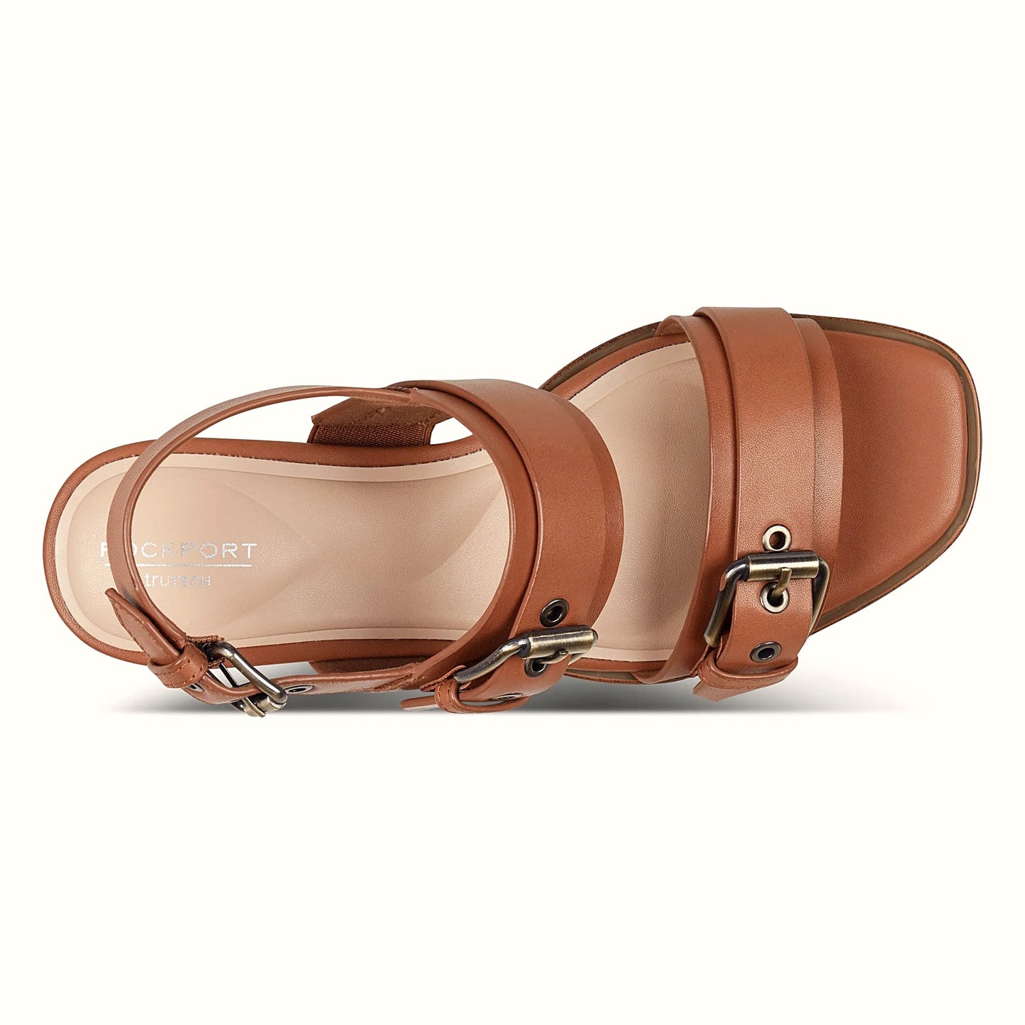 Pair of buckled slingback sandals photographed from above on a plain background