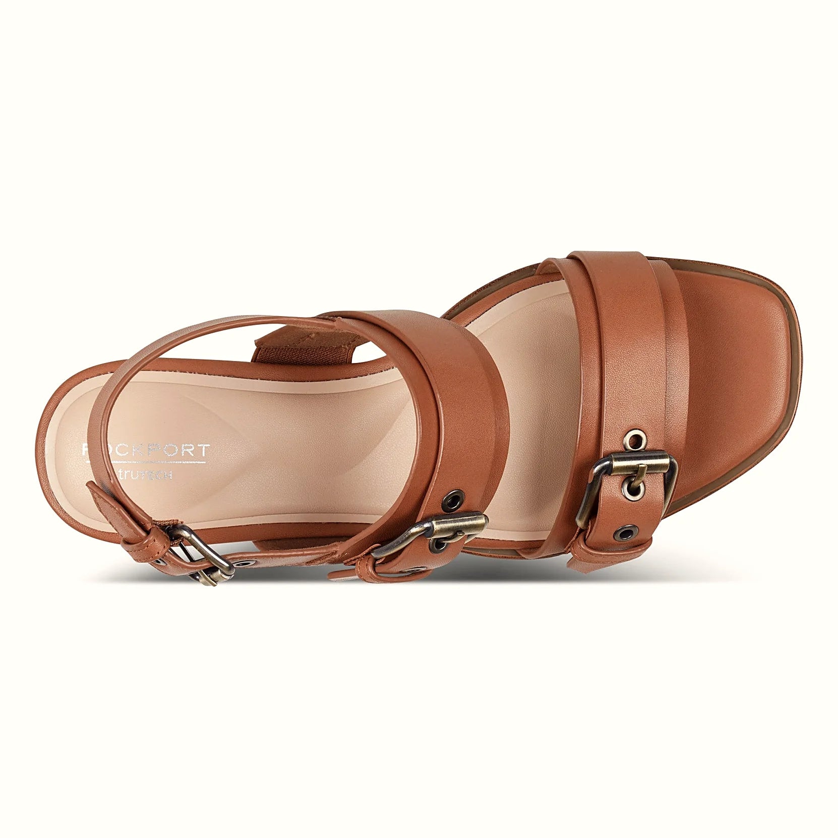 Pair of buckled slingback sandals photographed from above on a plain background