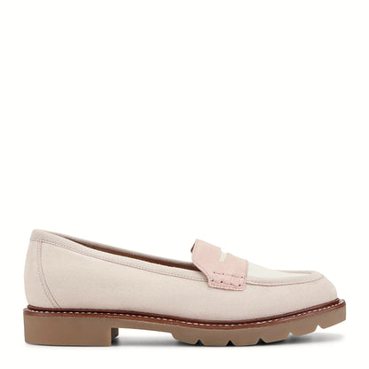 Side view of a light pink penny loafer on a substantial lug sole