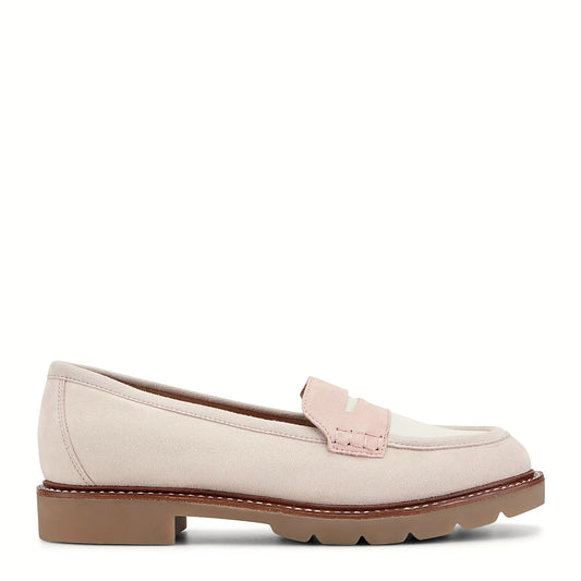 Side view of a light pink penny loafer on a substantial lug sole