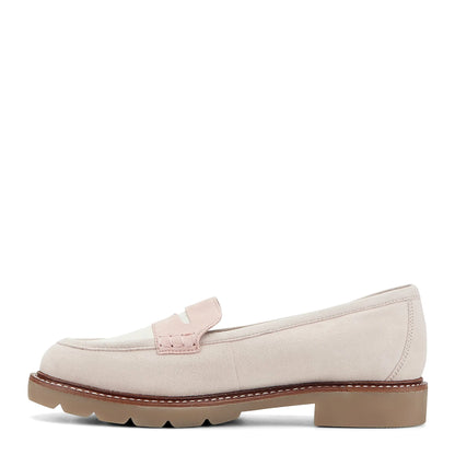 Pair of lug sole penny loafers photographed from above on a plain background
