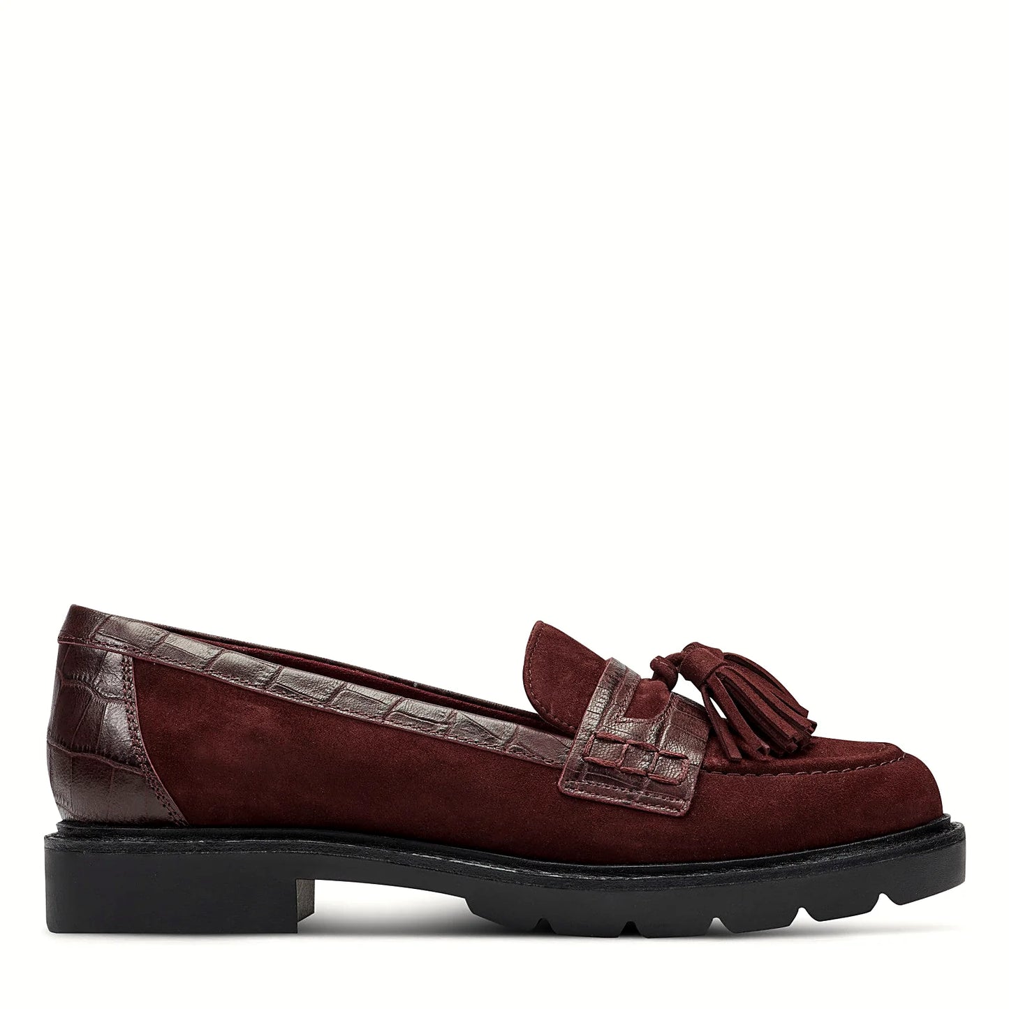 Side view of a dark red suede tassel loafer on a lugged rubber outsole
