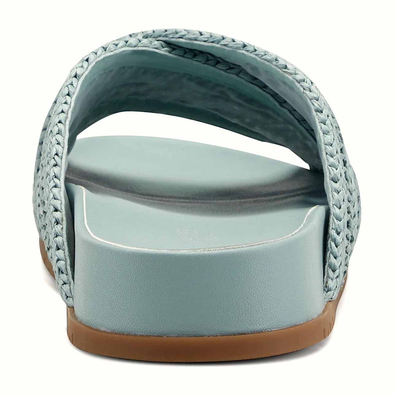 Rear view of a flat slide sandal showing the nubby traction outsole
