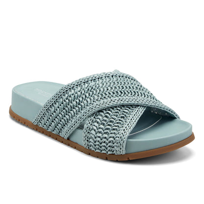 Close view of the wide crossing straps over the forefoot of a sandal