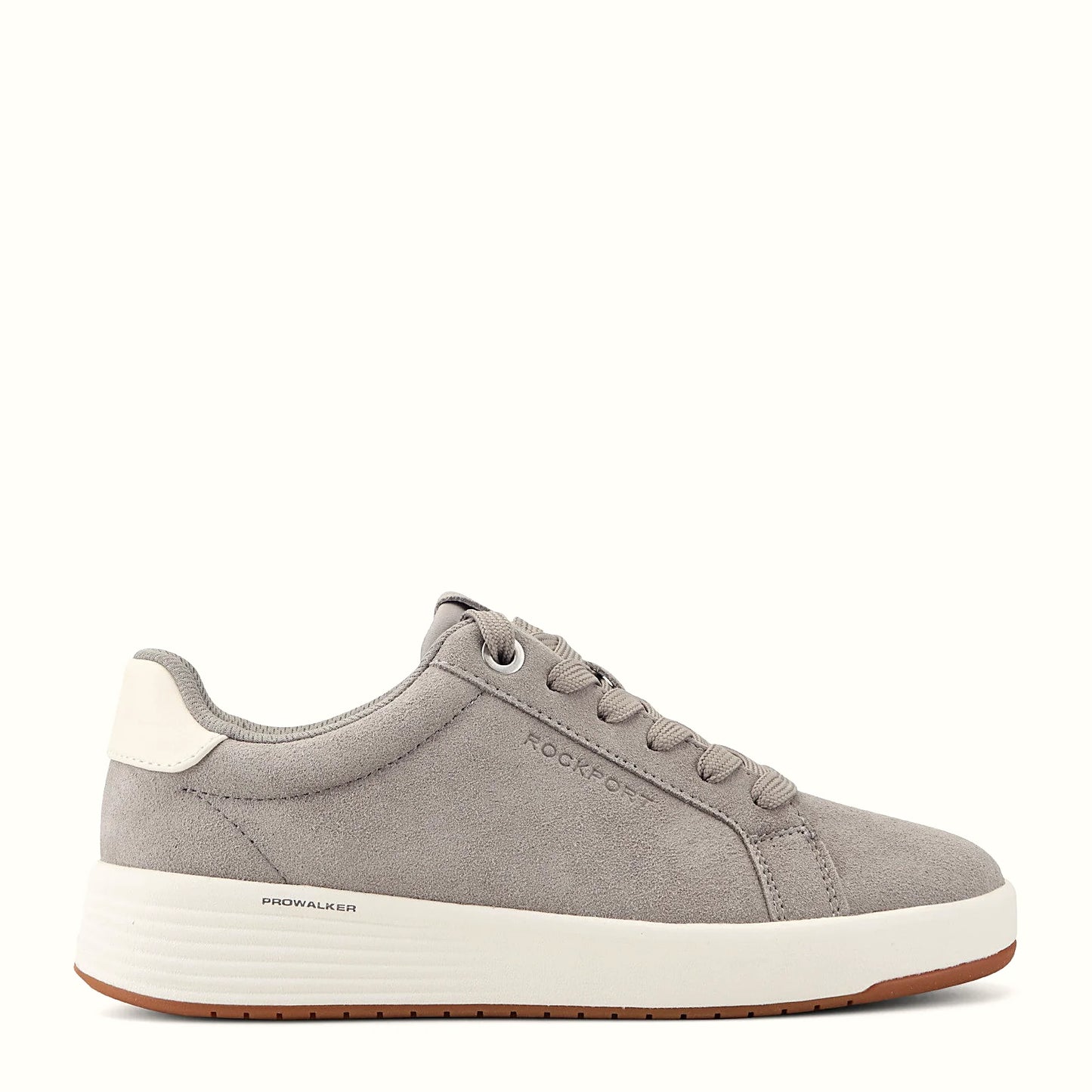 Side view of a medium gray suede sneaker with clean panel stitching