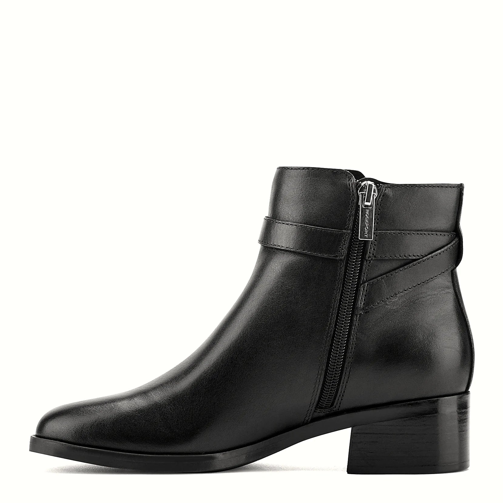 Pair of ankle booties photographed from above on a plain background