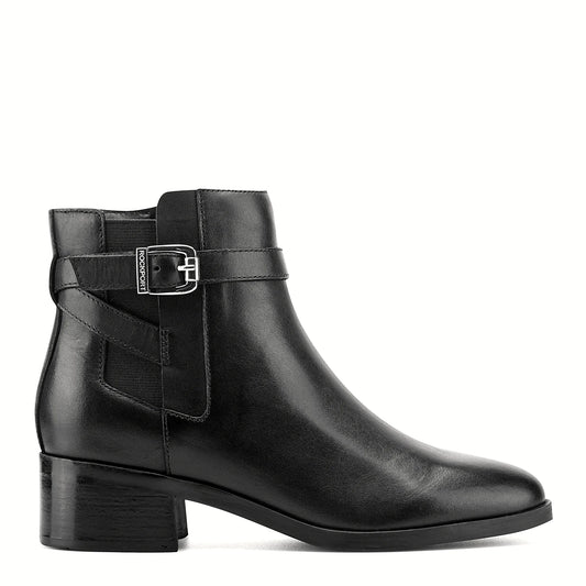 Side view of a black ankle bootie showing the stretch gore panel at the shaft