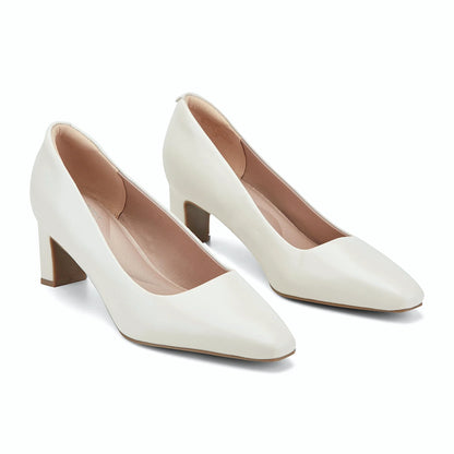 Angled view of a block heel pump showing the squared toe and heel height
