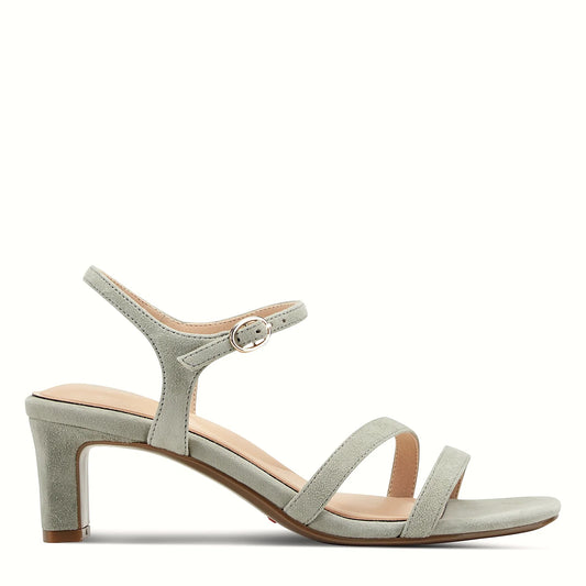 Side view of a light blue suede dress sandal with crossover forefoot straps