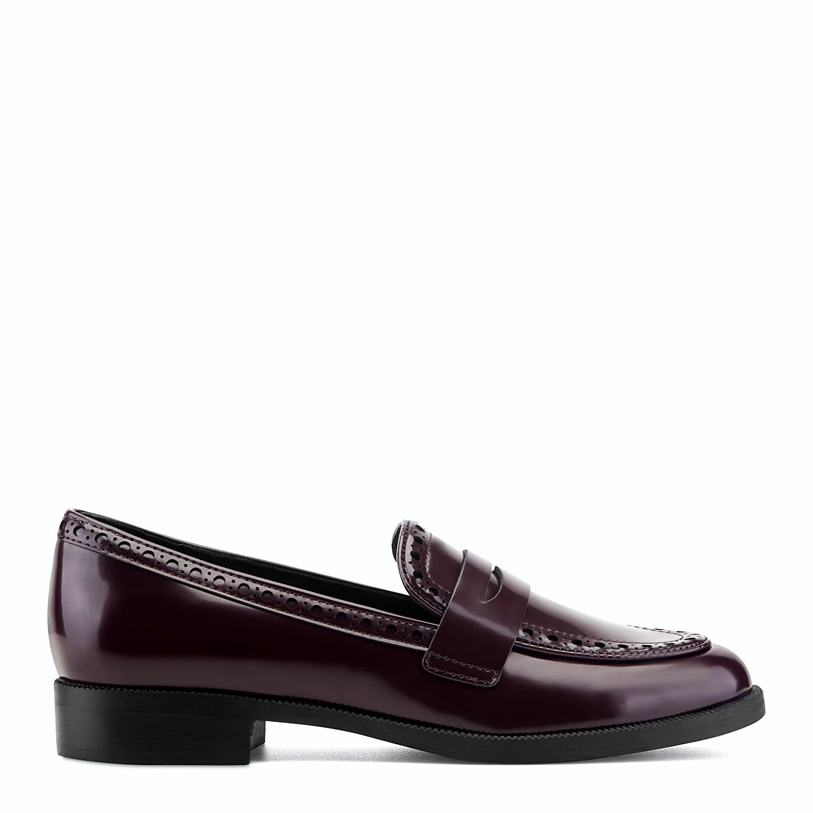 Side view of a dark red patent penny loafer with brogue perforations