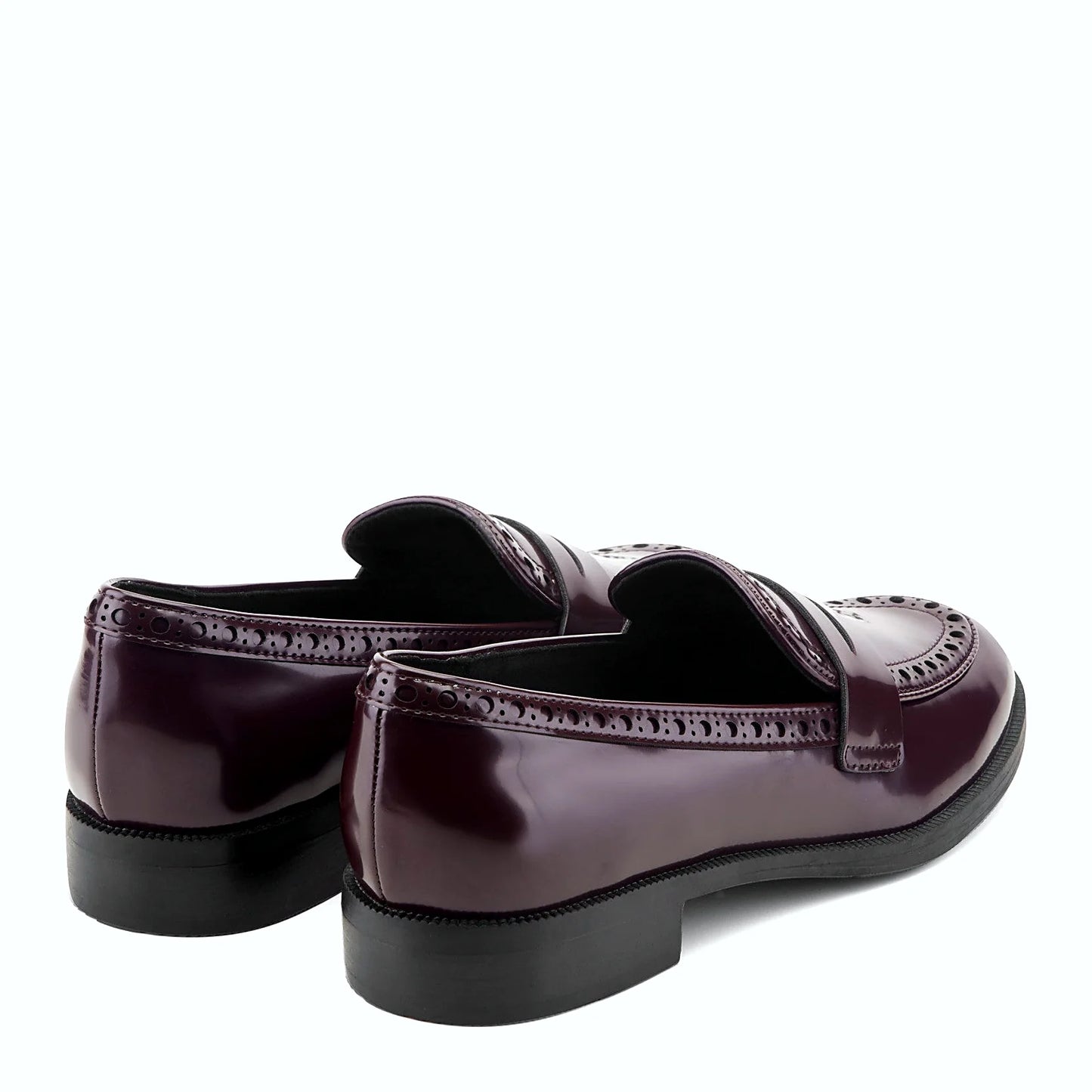 Rear view of a penny loafer showing the low stacked heel and treaded outsole