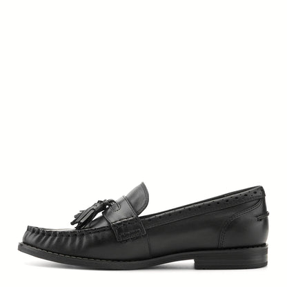 Pair of tassel moc-toe loafers photographed from above on a plain background
