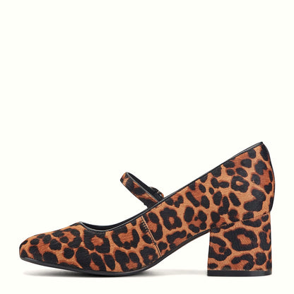 Pair of mary jane block heel pumps photographed from above on a plain background