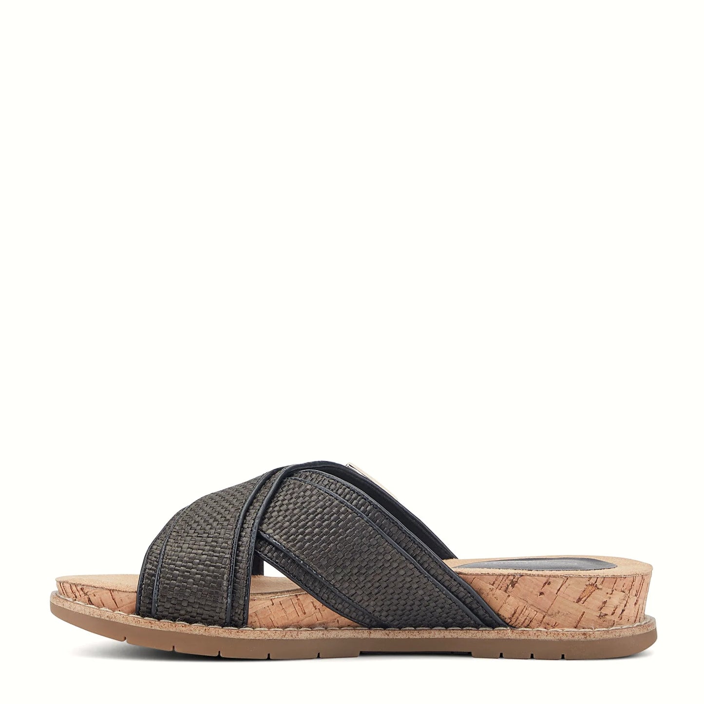 Pair of woven slide sandals photographed from above on a plain background