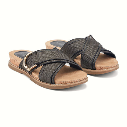 Close view of the crossover straps and polished gold buckle on a slide sandal