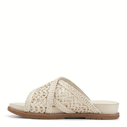 Pair of lattice slide sandals photographed from above on a plain background