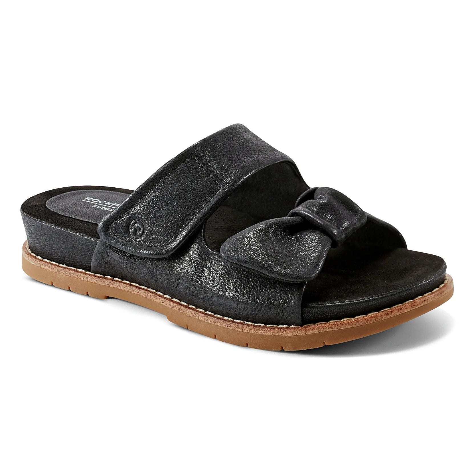 Close view of the gathered knot detail at the forefoot of a sandal
