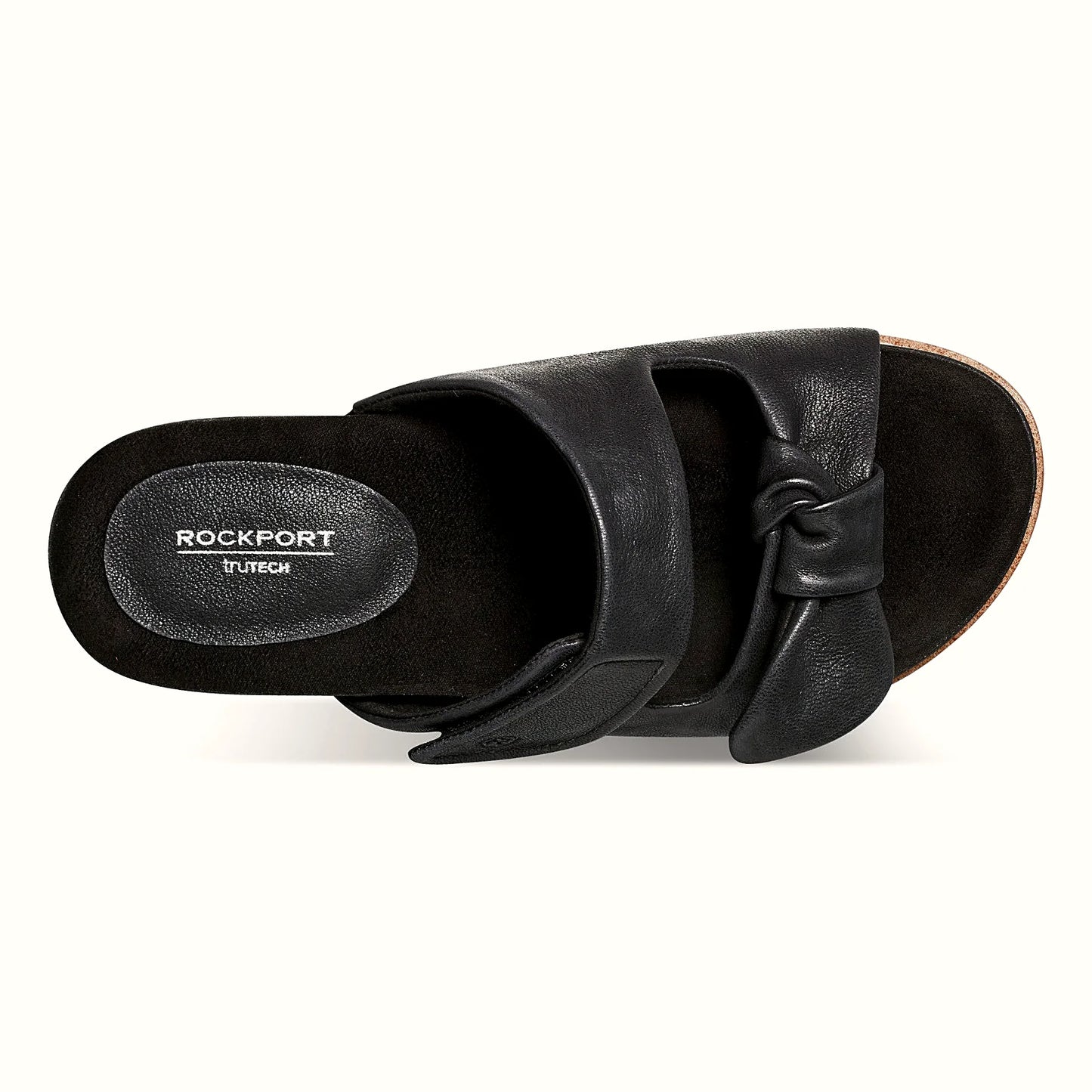 Pair of knotted two-strap sandals photographed from above on a plain background