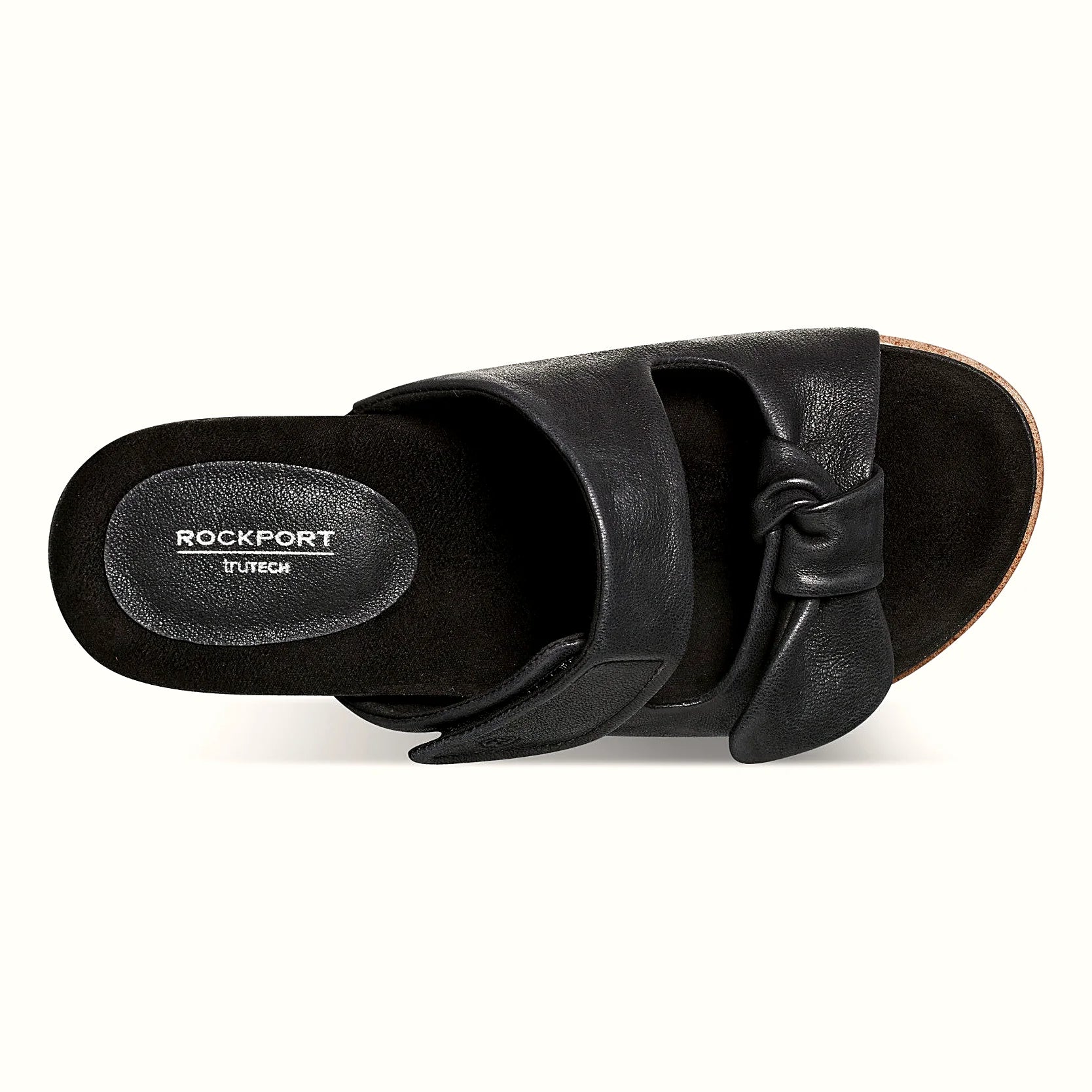 Pair of knotted two-strap sandals photographed from above on a plain background