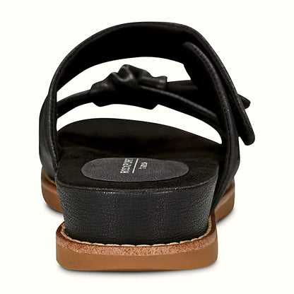 Rear view of a flat sandal showing the low-profile midsole and tread